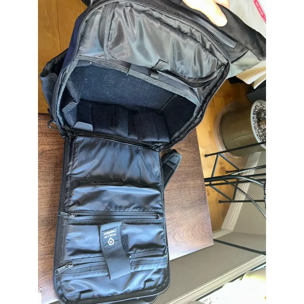 WANDRD PRVKE Lite travel camera backpack black roll-top closure magnetic handles